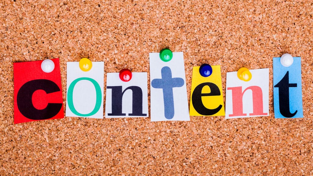 The word content is spelled out with different types of paper, typography and colours for each letter